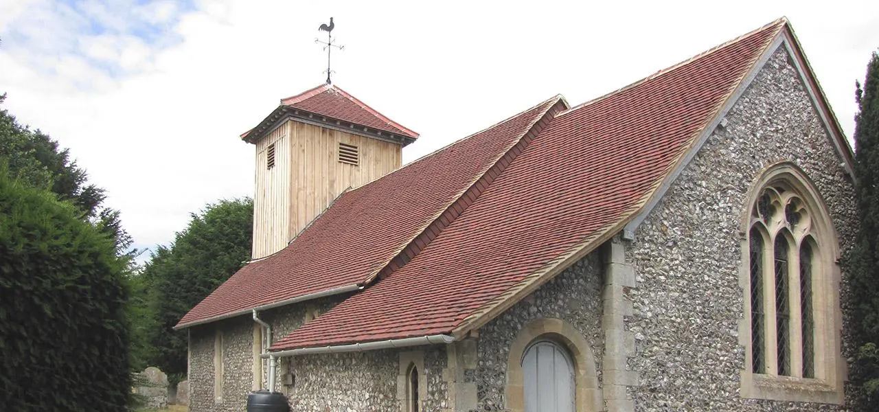 Church with a steep roof of handmade clay tiles