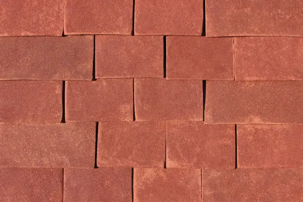 Red Antique handmade clay tiles laid on a sample panel