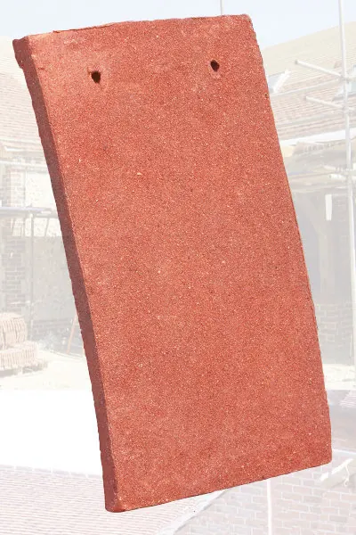 Rustic Red handmade clay tiles laid on a sample panel