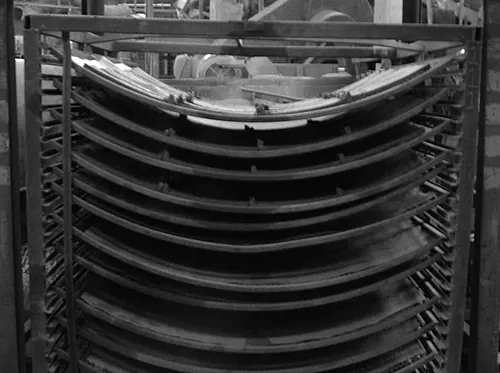 Drying trays stacked in racks