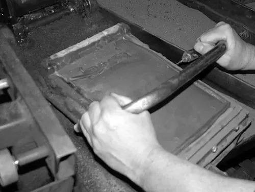 The back of a tile being cut to thickness