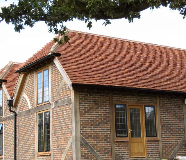 Roof finished in Tudor handmade clay tiles, example 2